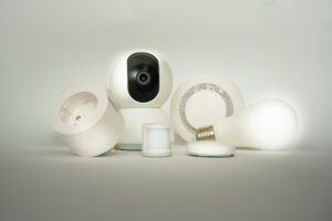 Smart-home devices including a security camera and connected controls, illustrating Home Assistant 2026.11 beta