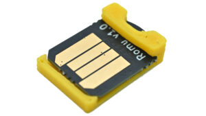 Gold USB Type-A contacts of the black Romu RP2354A board inside a yellow protective shim.