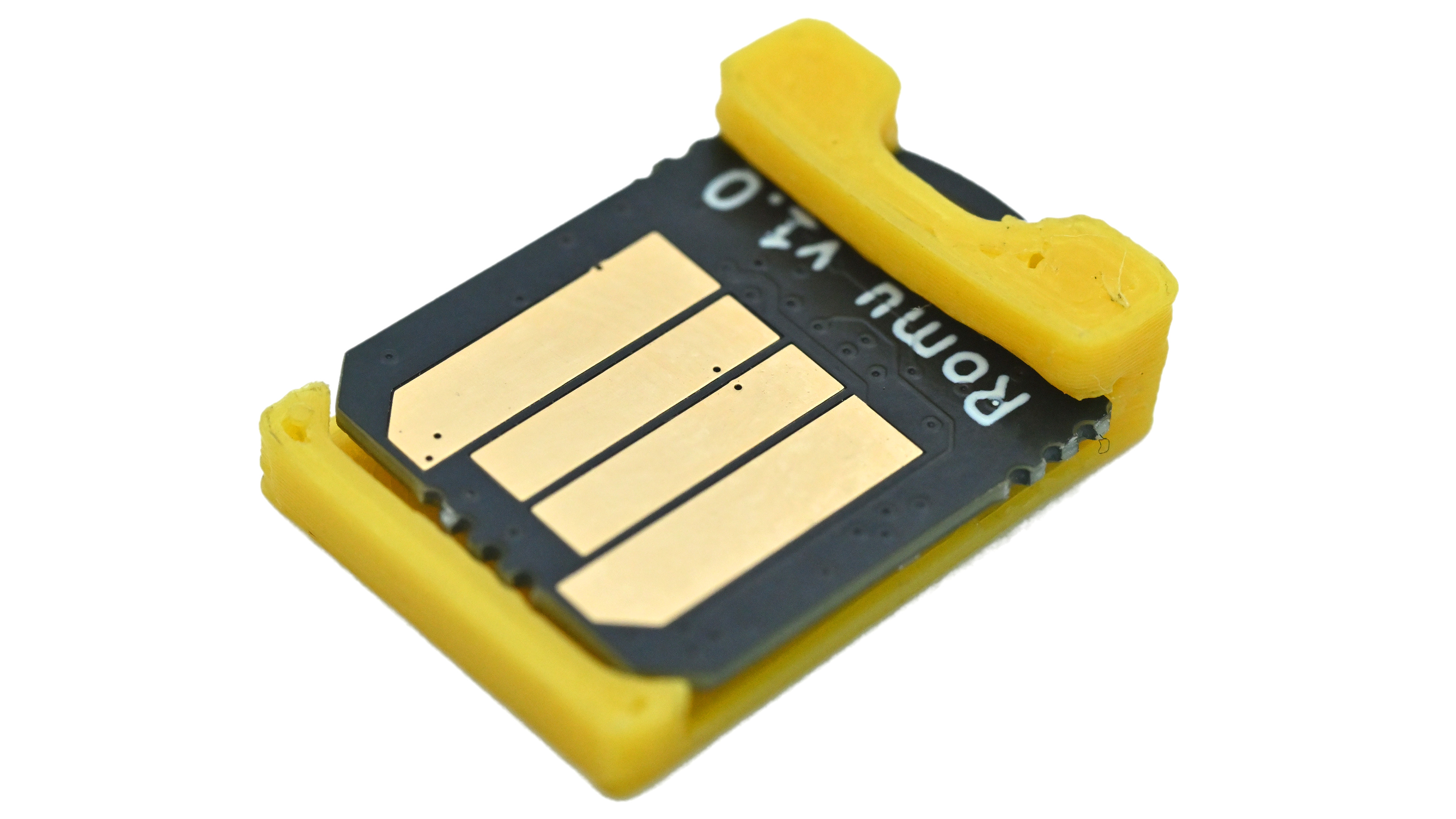 Gold USB Type-A contacts of the black Romu RP2354A board inside a yellow protective shim.